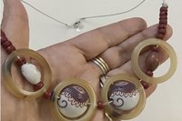 Vintage Light Brown Bakelite Rings, Wine Red/ White Ceramic and Small Glass Beads make up this Boho Necklace on silver leather