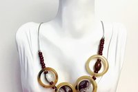 Vintage Light Brown Bakelite Rings, Wine Red/ White Ceramic and Small Glass Beads make up this Boho Necklace on silver leather