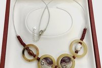 Vintage Light Brown Bakelite Rings, Wine Red/ White Ceramic and Small Glass Beads make up this Boho Necklace on silver leather